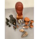 A selection of collectables turned mushrooms, sculpture of a girl, cast duck etc