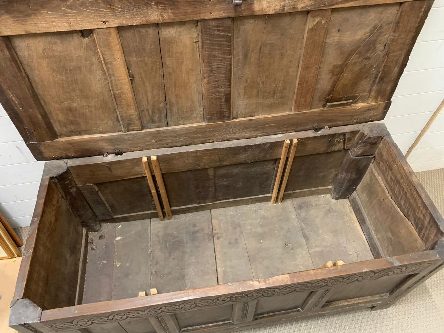 A 17th Century four panelled Coffer with hinged lid raised on bracket feet 135 L x 58 D x 63H - Image 3 of 8