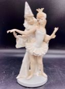 A Lladro figure of a clown and ballerina dancer