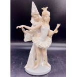 A Lladro figure of a clown and ballerina dancer