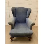 A mahogany wing armchair with cabriole front legs