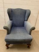 A mahogany wing armchair with cabriole front legs