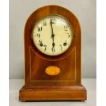 A Domed mahogany, with fruitwood inlay eight day mantle clock.