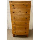 A tall pine bow fronted chest of six drawers with bun handles (H126cm W60cm D53cm)