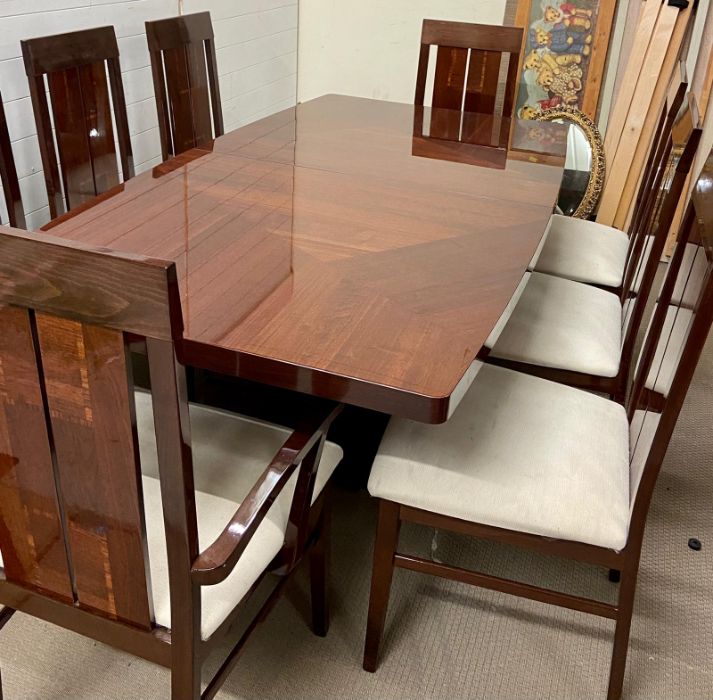 A dining table with six chairs and two carvers made in Italy with one leaf (H78cm W196cm D107cm Leaf