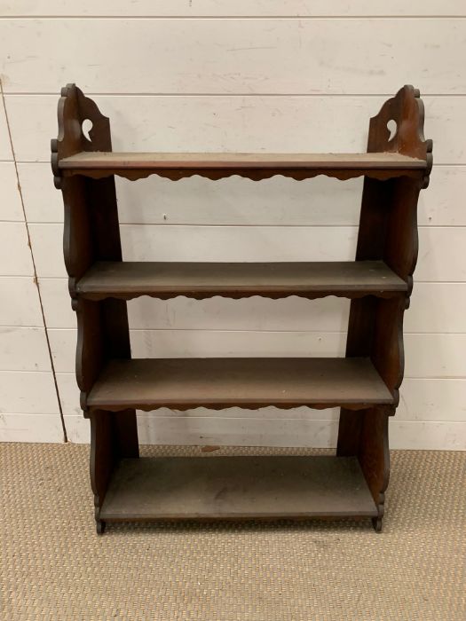 A floor standing four tier oak open shelves unit (88cm x 60cm)