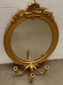 A giltwood wall mirror with overlapping leaves to frame and three arm branches (H100cm W58cm)