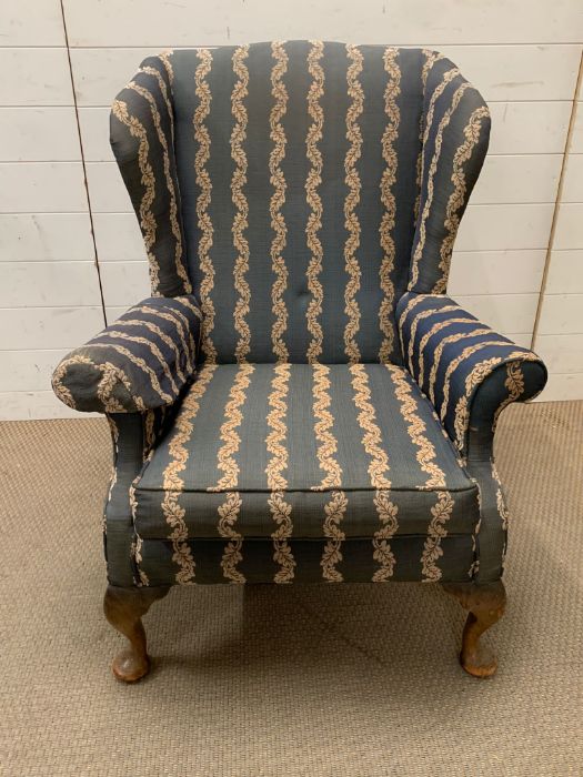 A George III style mahogany wing armchair