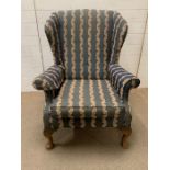 A George III style mahogany wing armchair