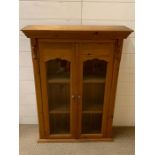 A Pine wall cabinet, with glazed front.(95 cm h x 71 cm w)