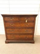 A George III style chest of drawers with brass handles and bracket feet (H123cm W107cm D44cm)