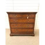 A George III style chest of drawers with brass handles and bracket feet (H123cm W107cm D44cm)