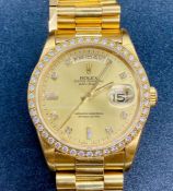 Rolex Oyster Perpetual Day Date watch in 18ct gold with diamond bezel supported by original box