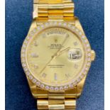 Rolex Oyster Perpetual Day Date watch in 18ct gold with diamond bezel supported by original box