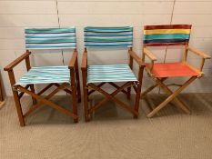 Three folding beach chairs