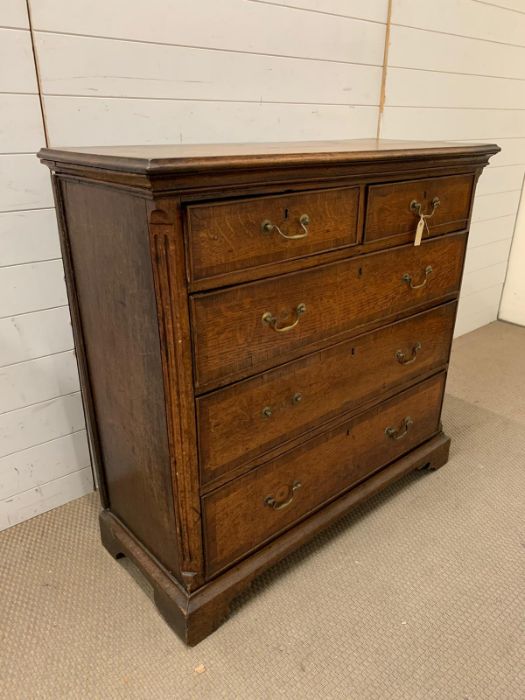 A George III style chest of drawers with brass handles and bracket feet (H123cm W107cm D44cm) - Image 3 of 9