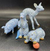 A group of four Herend porcelain figures in blue fishnet pattern to include Otter, Pig, Fawn and a