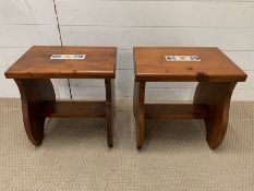 Two wooden stools with a tile to centre