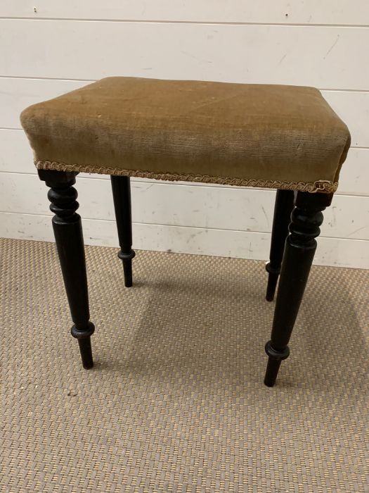 An ebonised stool (H52cm W42cm D32cm)