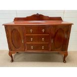 A Mahogany sideboard consisting of three centred drawers, flanked by a cupboard wither side (H 112cm