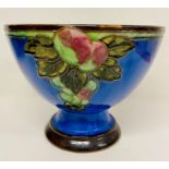 A Royal Doulton stoneware glazed tubeline bowl c1933, embossed fruit decoration on cobalt blue