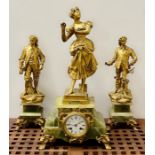 A French gilt metal and onyx statue garniture clock
