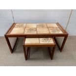 A Mid Century teak tile top coffee table with a nesting table to centre (H40cm W94cm D46cm)