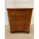 A sales man size chest of drawers on bracket feet (H52cm W39cm D28cm)