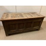 A 17th Century four panelled Coffer with hinged lid raised on bracket feet 135 L x 58 D x 63H