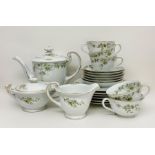 An Ohata China six place tea service, missing one teacup,