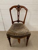 A Victorian dining chair with turned legs
