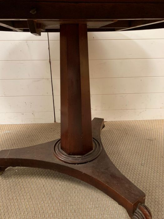 A Regency style breakfast table the tilt top on faceted shaft on a tri-form platform base (H72cm - Image 2 of 6