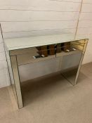 A mirrored dressing table (H83cm W100cm D39cm)