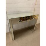 A mirrored dressing table (H83cm W100cm D39cm)