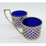 Two hallmarked silver mustards with blue glass liners