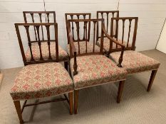 A set of 6 Sheraton mahogany dining chairs including 1 armchair, each with square back and 3