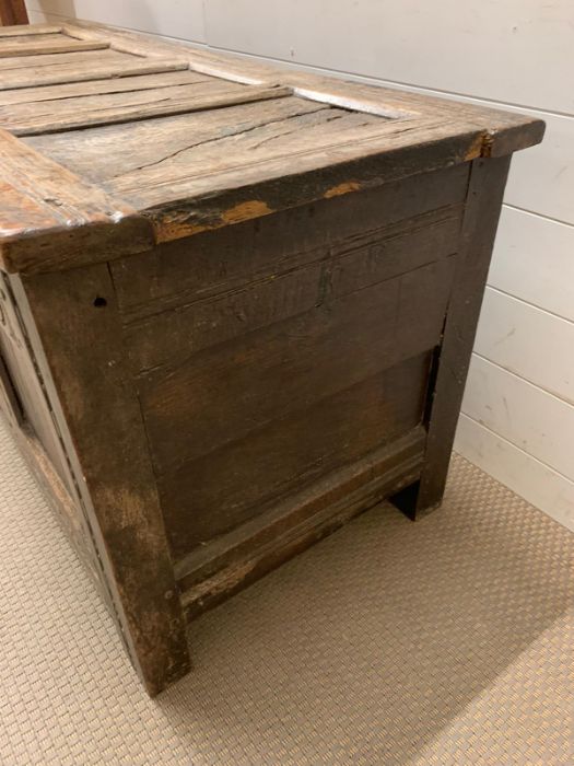 A 17th Century four panelled Coffer with hinged lid raised on bracket feet 135 L x 58 D x 63H - Image 7 of 8