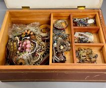 A large jewellery box with a large volume of costume jewellery.