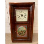 A wall hanging clock (H75cm W42cm)