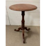 A mahogany occasional table on turn centre support on tri pod base