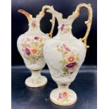 A pair of Ewer, high handled, painted with floral decoration