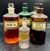 A selection of glass apothecary jars/bottles with glass stoppers