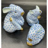 A Group of three Herend, porcelain figures in fishnet pattern, two rabbits and a mouse.