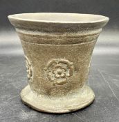 A Bronze mortar with a Tudor rose embossed design.