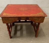 A red oriental ceremonial style folding end table (H33cm W39cm D33cm)