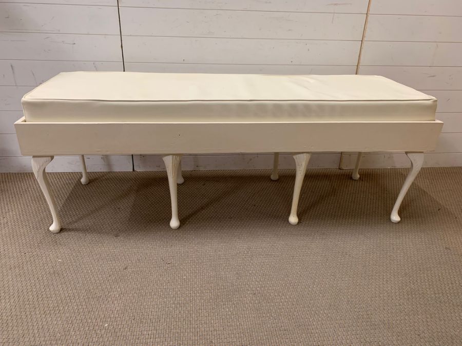 A white bench seat on cabriole legs and faux seat pad (H59cm W160cm D55cm)