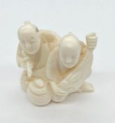 Japanese Ivory Netsuke men with a fish.