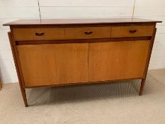 A Mid Century teak sideboard with pole style legs to side (H87cm W138cm D47cm)