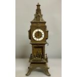 A cast metal mantle clock in the form of a clock tower, French or Flemish AF 52cm H x 15cm