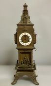 A cast metal mantle clock in the form of a clock tower, French or Flemish AF 52cm H x 15cm